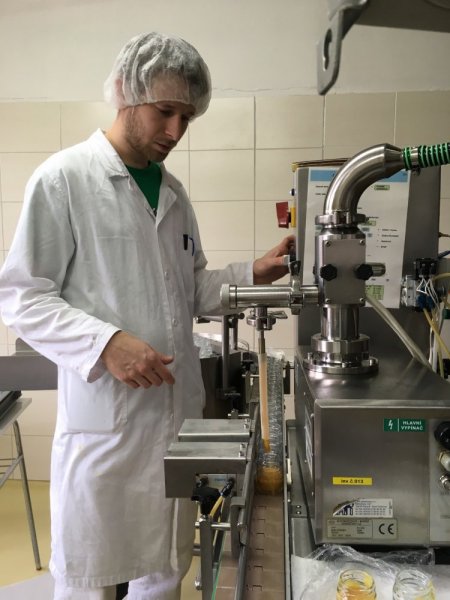 Martin Pleva in the operation plant during the bottling of ointment with propolis, 2018